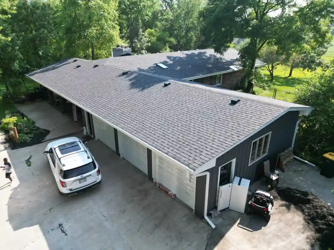 Completed roofing project with new shingles and improved exterior appearance