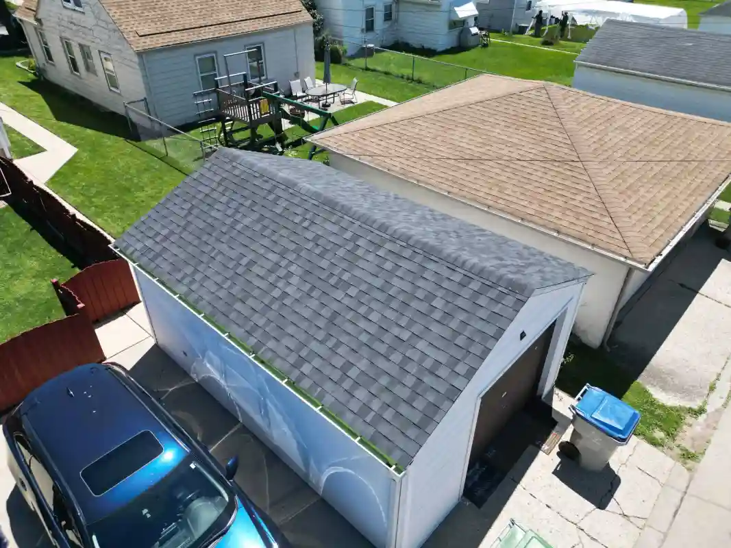 Completed roofing project showing upgraded shingles and improved roof condition