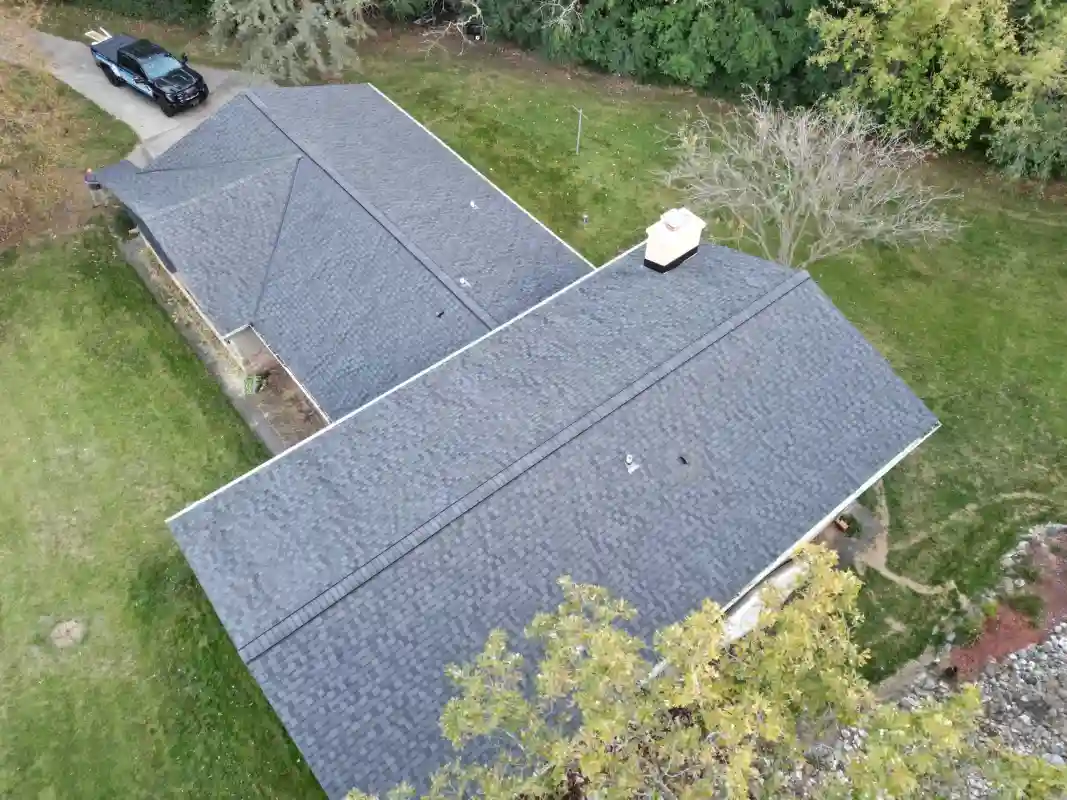 Finished roof replacement project showing improved exterior roof condition