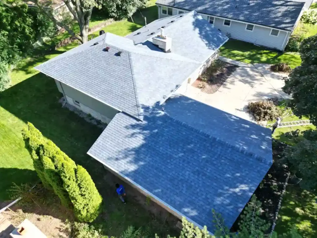 Roofing project showing before and after improvements on residential home
