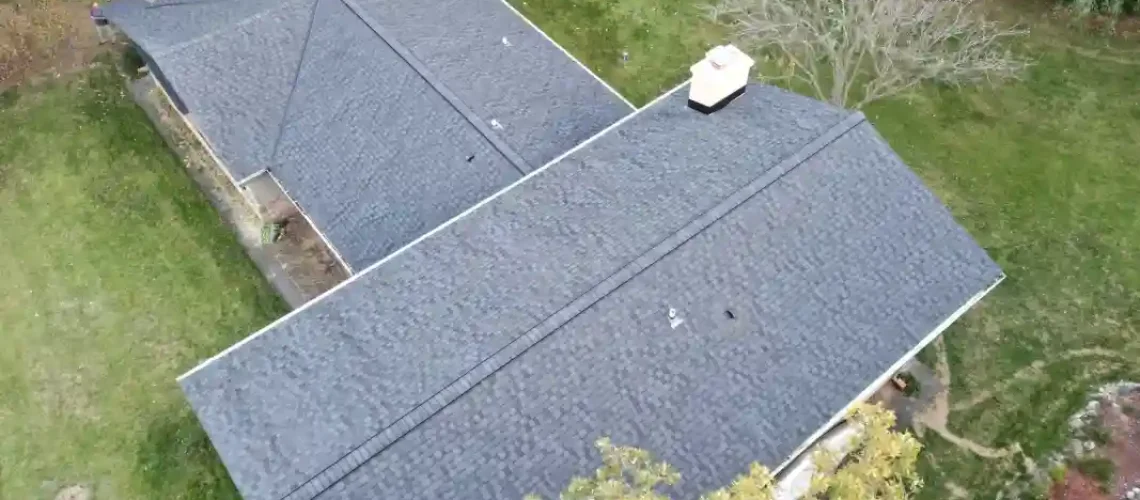 Finished roof replacement project showing improved exterior roof condition