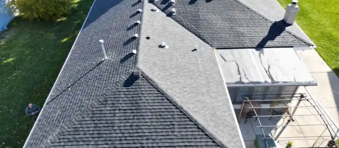 Completed residential roofing project with new shingles installed
